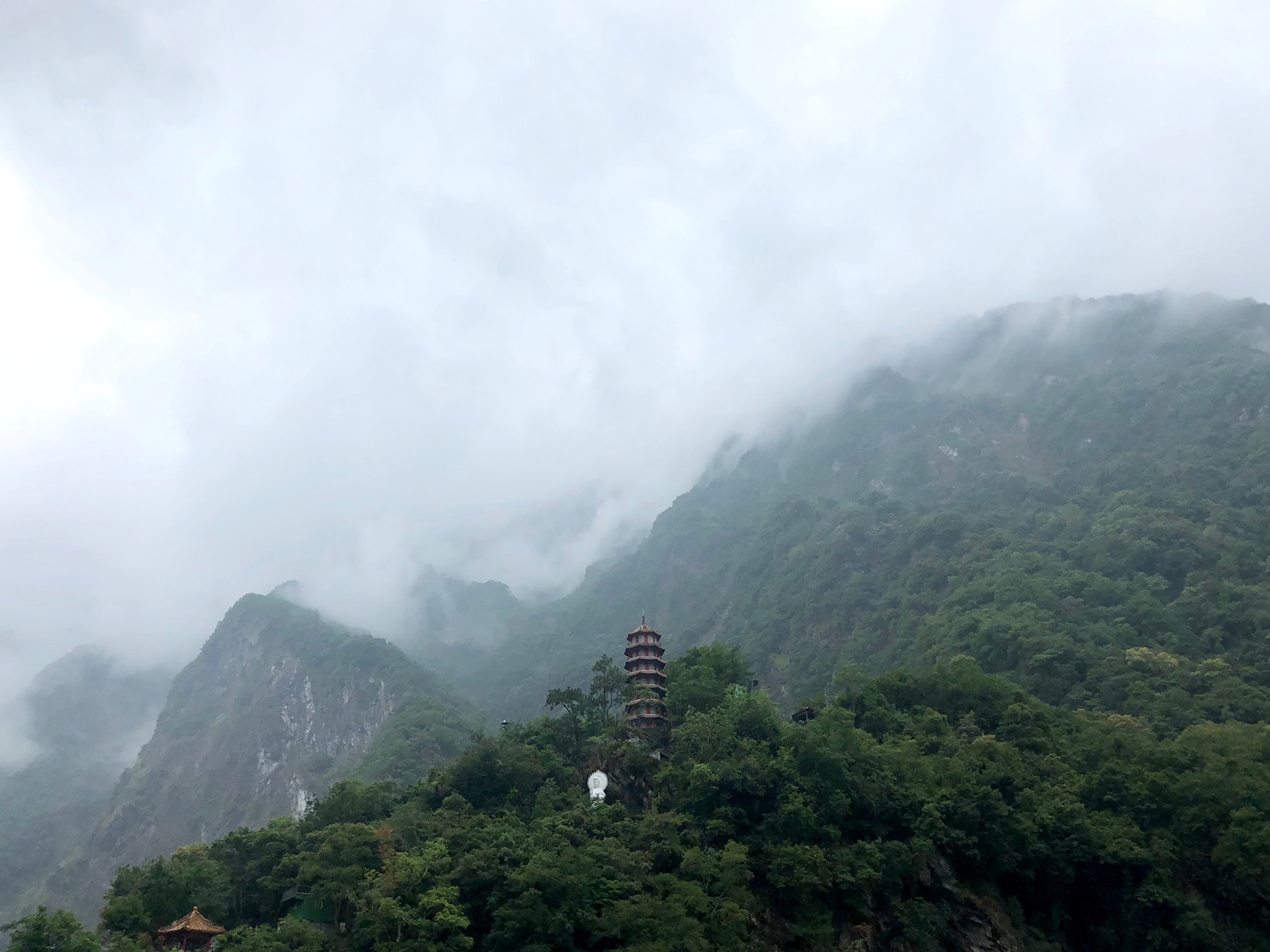 Temple and white buddha in mountains at Taroko Park